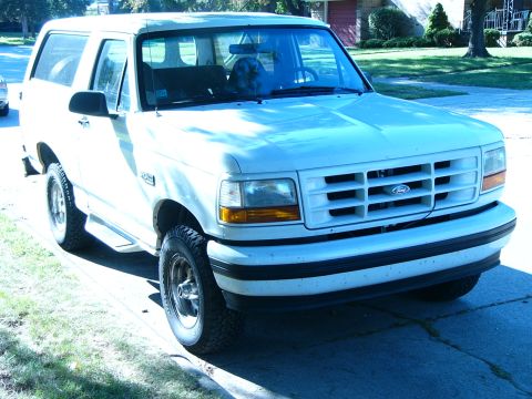 1996 Ford Bronco - This 1996 Ford Bronco is parked on a sunny day in front of a house.