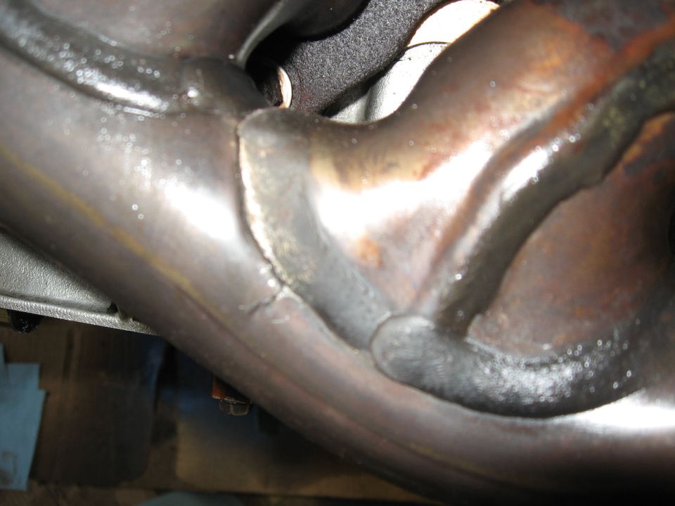 Close-up of welds on an exhaust manifold