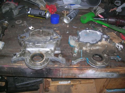 1985 Ford Bronco - FI timing cover on the left and Carburated on the right...notice the fuel pump cut off plate.