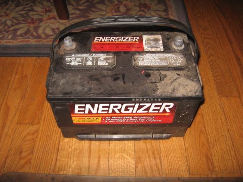 1996 Ford Bronco - Energizer car battery with warranty and replacement information visible on labels.