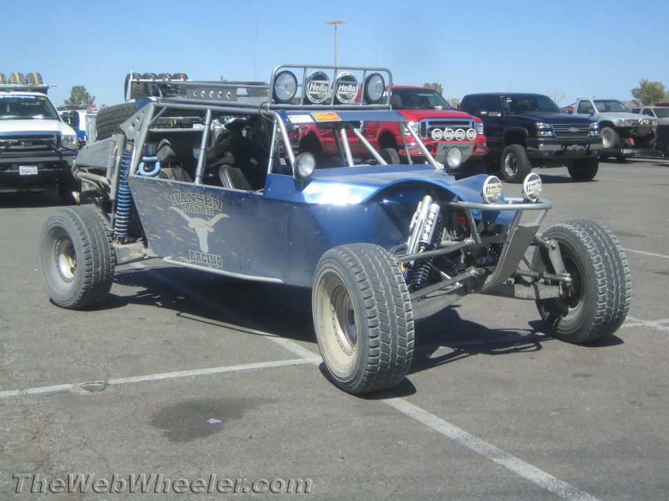 Blue long-travel off-road sand rail buggy parked in a lot