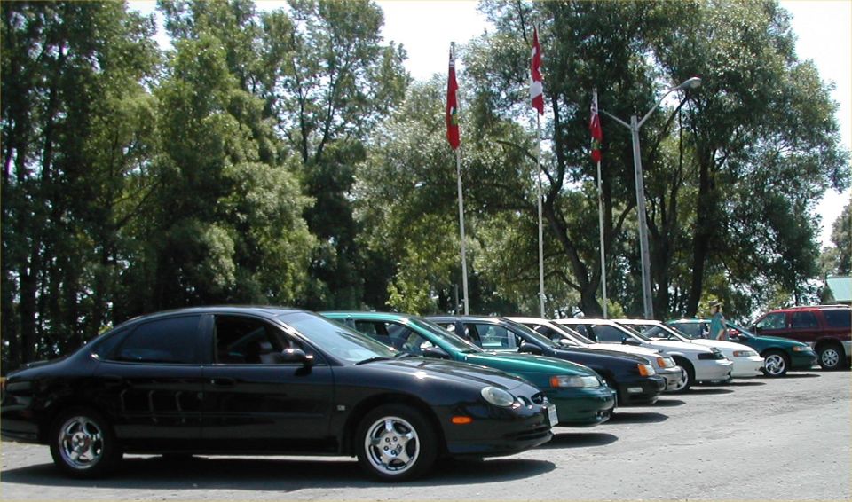 Black 1997 Ford Taurus sedan, side view