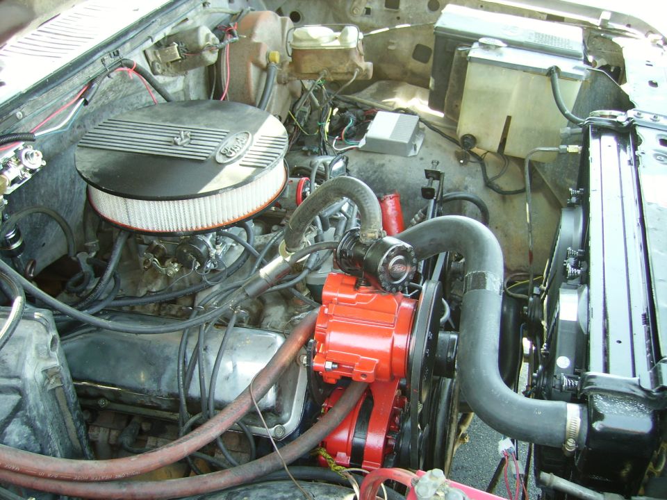 Engine bay with red alternator and air filter