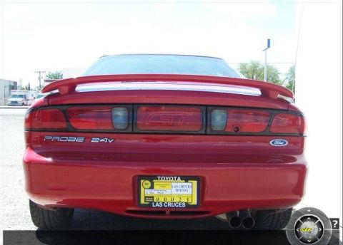 1996 Ford Probe - Rear view of a red 1996 Ford Probe GT, showing the taillights, spoiler, and GT badging.