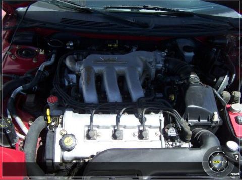 1996 Ford Probe - Close-up view of a car's engine compartment, highlighting the V6 engine components.