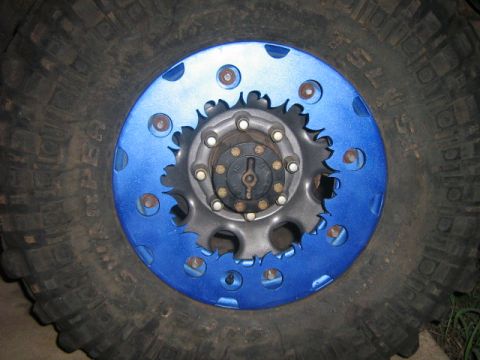 1986 Ford Bronco - This is a close-up view of a custom beadlock wheel on a large off-road tire.