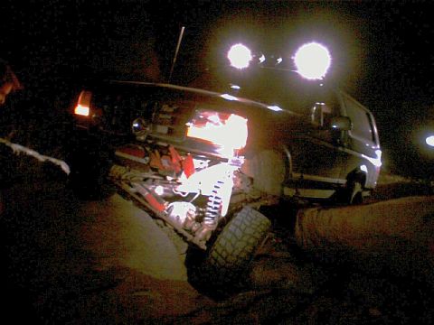 1996 Ford Bronco - A 1996 Ford Bronco is shown at night with auxiliary lights illuminating the scene.