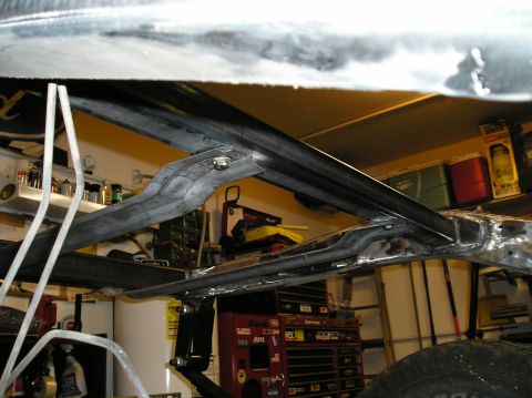 1986 Toyota Hilux - Underbody view of vehicle frame and suspension components, possibly during restoration.