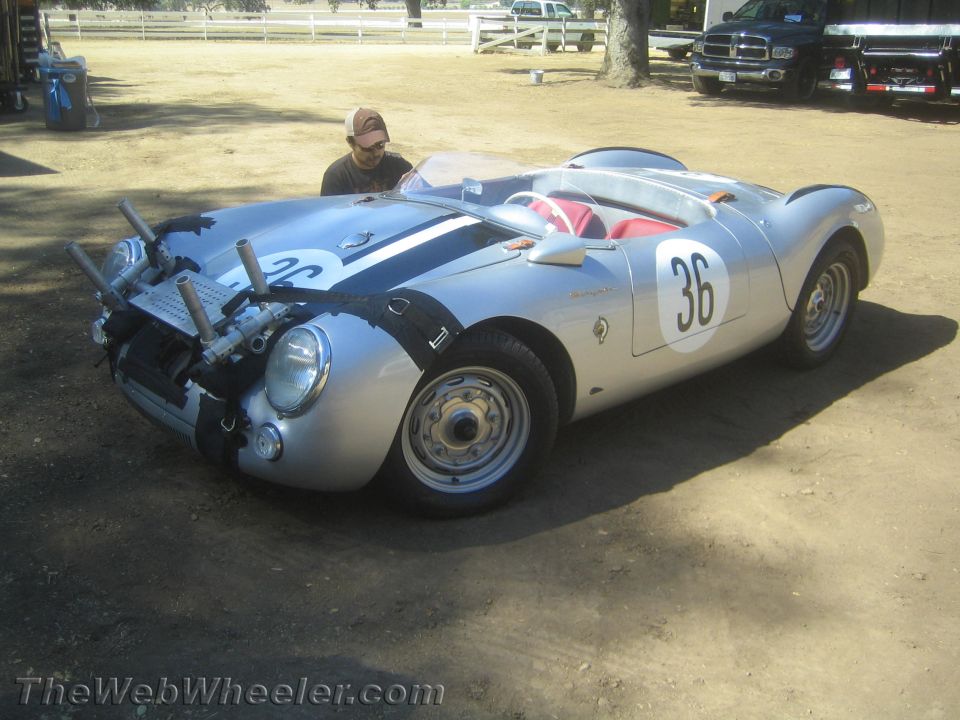 Front view of silver roadster numbered 36 with front bodywork removed