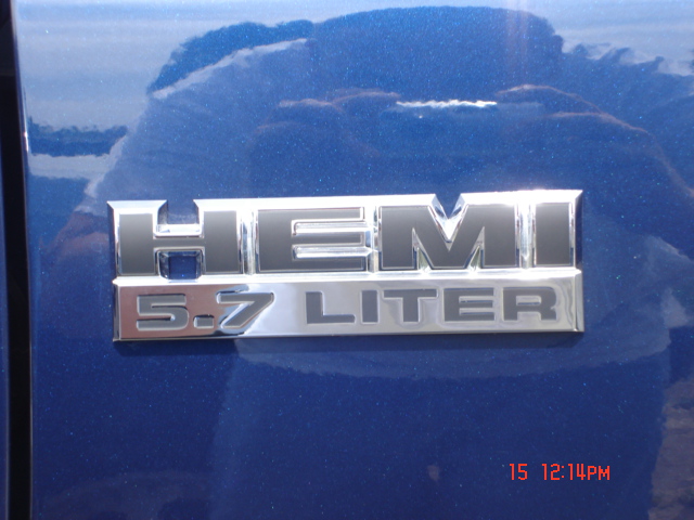 HEMI 5.7 LITER badge on blue vehicle body