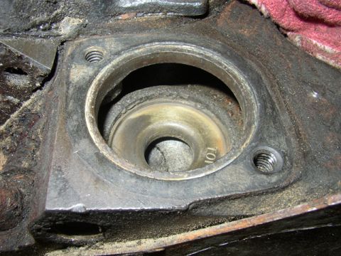 1972 Ford Ranchero - Close-up view of an engine's cylinder head, revealing a worn valve seat and surrounding metal.