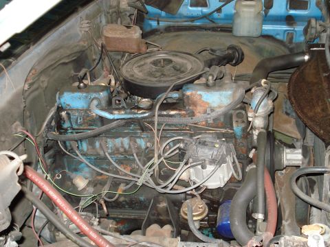 1979 Chevrolet C/K Pickup - Close-up view of a vehicle's engine bay, showing the engine and associated components.