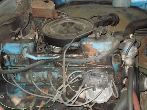 1979 Chevrolet C/K Pickup - The engine bay shows a V8 engine with visible spark plug wires and distributor cap.
