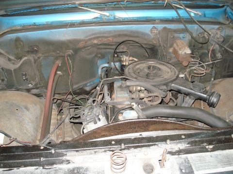 1979 Chevrolet C/K Pickup - The engine bay of a 1979 Chevrolet C/K Pickup displays its V8 engine and associated components.