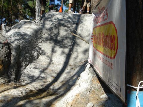 2002 Jeep Wrangler - Spectators watch an off-road obstacle course event, with a banner visible on the right.