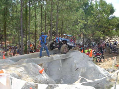 2002 Jeep Wrangler - Competitors navigate a challenging obstacle course during an off-road event.