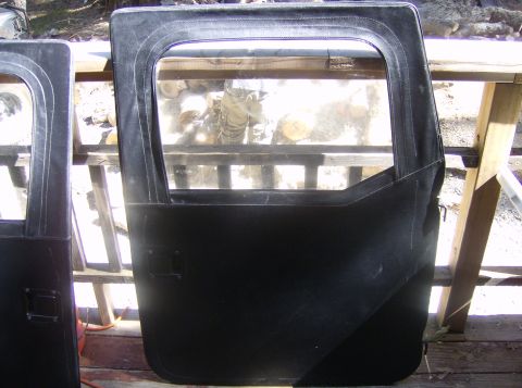 1986 Ford Bronco - Two black soft doors with windows are shown, likely for an off-road vehicle.