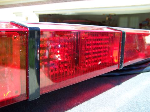 2003 Ford Crown Victoria - Close-up of a red light bar, likely from an emergency vehicle.