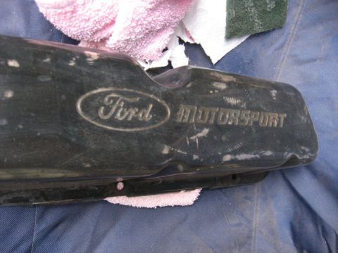 1989 Ford F-250 - A close-up view of a Ford Motorsport valve cover, indicating it is a component rather old part.
