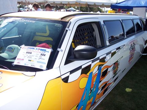 1972 Ford Ranchero - This custom limousine features flame and checkered flag graphics, with a sign on the windshield indicating it was part of the 'Wild West Au…