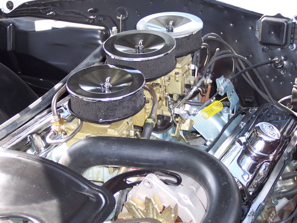 Engine with triple carburetors and chrome valve covers