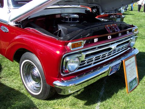 1972 Ford Ranchero - A red 1966 Ford Ranger pickup truck is displayed with its hood up, revealing the engine bay.