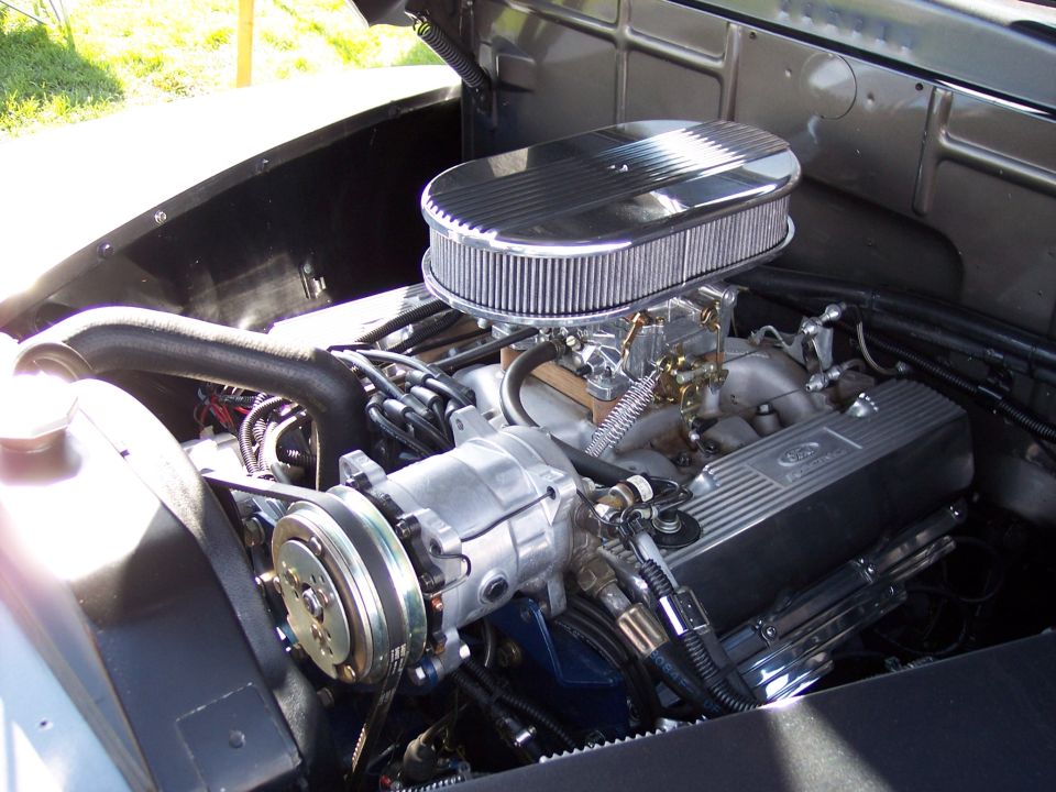 Ford V8 engine, chrome air cleaner, carburetor, AC compressor, and Ford valve covers