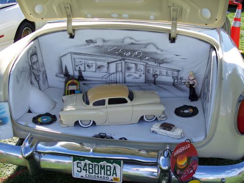 1972 Ford Ranchero - The trunk of a car is decorated with a 50s-themed airbrushed mural and miniature car displays.