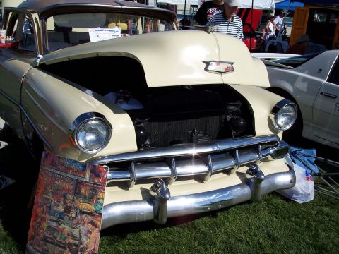 1972 Ford Ranchero - Front view of a 1950 Chevrolet sedan at an outdoor car show.