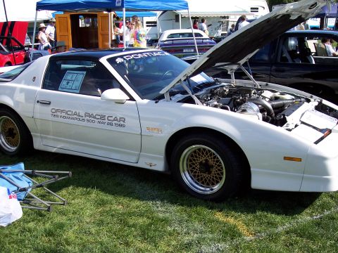 1972 Ford Ranchero - A white 1989 Pontiac Firebird, designated as the official pace car for the Indianapolis 500, is displayed with its hood open.