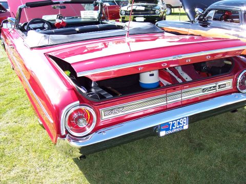 1972 Ford Ranchero - This red 1964 Ford Galaxie 500 convertible has its trunk open, revealing its contents.