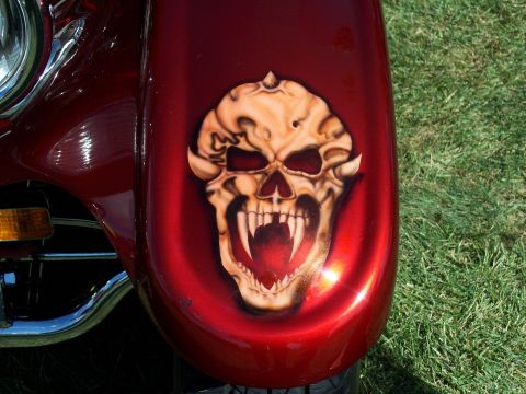 1972 Ford Ranchero - Close-up of a custom airbrushed skull graphic on a vehicle fender.