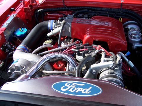 1972 Ford Ranchero - Engine bay details a Ford 5.0 HO engine with custom chrome components and a prominent Ford oval emblem.