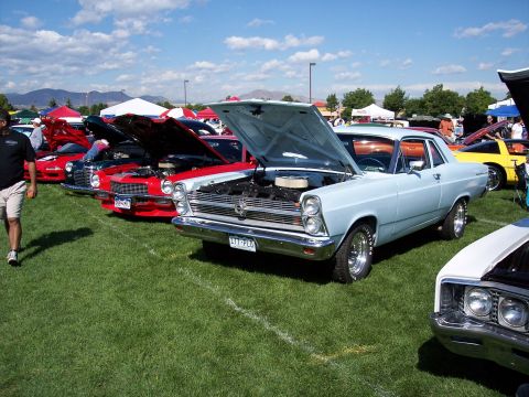 1972 Ford Ranchero - A light blue 1966 Ford Fairlane is displayed with its hood open at an outdoor car show.