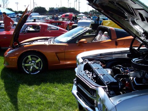 1972 Ford Ranchero - Multiple vehicles on display at an outdoor car show, with hoods open.