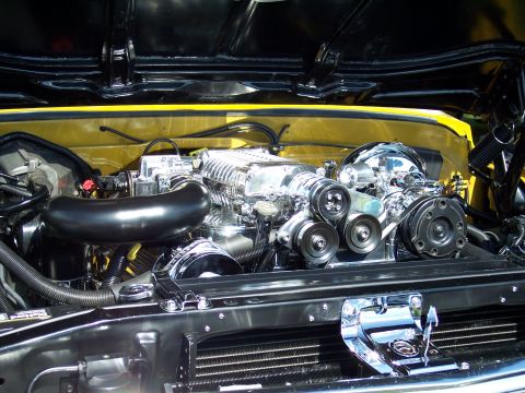 1972 Ford Ranchero - Close-up of a highly polished, supercharged V8 engine with chrome components.