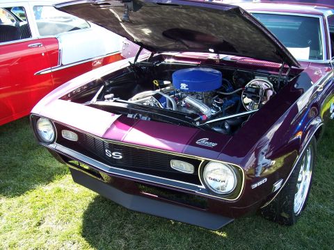 1972 Ford Ranchero - A purple 1969 Chevrolet Camaro SS is displayed with its hood open, revealing the engine bay.