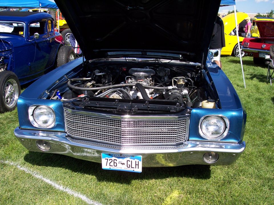 Blue 1970 Chevrolet Chevelle front view with hood open, chrome grille, and license plate 726 GLH