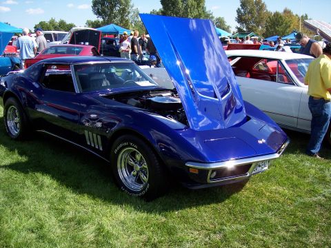 1972 Ford Ranchero - A blue 1970 Chevrolet Corvette Stingray is displayed with its hood open at an outdoor event.