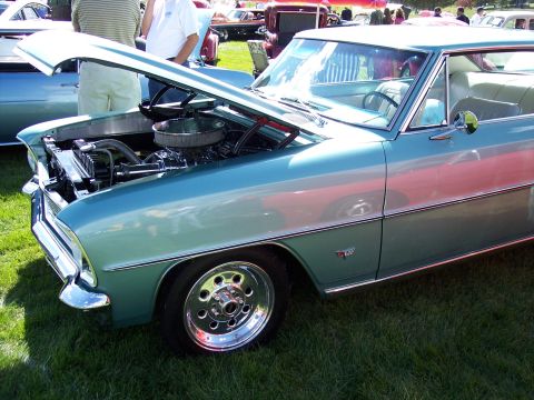 1972 Ford Ranchero - A teal and silver 1966 Chevrolet Nova is displayed with its hood open, revealing the engine compartment.