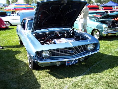 1972 Ford Ranchero - This 1969 Chevrolet Camaro is displayed with its hood open at an outdoor car show.