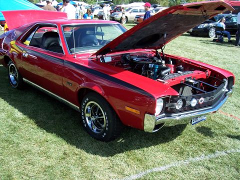 1972 Ford Ranchero - This red 1970 AMC AMX is displayed with its hood open, revealing the engine bay.