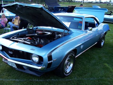 1972 Ford Ranchero - A light blue 1969 Chevrolet Camaro SS 350 is displayed with its hood open, revealing the engine and prominent SS badging.