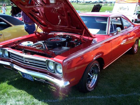1972 Ford Ranchero - A red 1969 Plymouth Road Runner is displayed with its hood open, revealing the engine compartment.