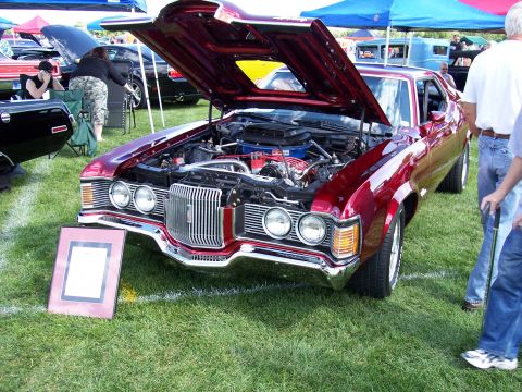 1972 Ford Ranchero - A 1972 Ford Ranchero is displayed with its hood open at an outdoor car show.