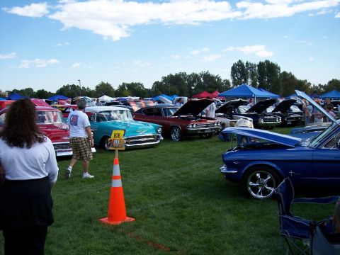 1972 Ford Ranchero - Outdoor car show many classic vehicles, including a turquoise 1957 Chevrolet.