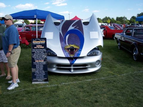 1972 Ford Ranchero - A Dodge Viper is displayed with its hood open, revealing a custom snake graphic and engine specifications sign.