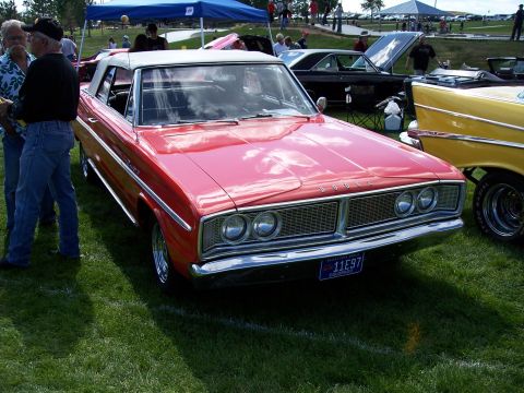 1972 Ford Ranchero - A red Dodge convertible is parked on grass at an outdoor car show.