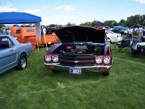 1972 Ford Ranchero - A red 1970 Chevrolet El Camino is displayed with its hood open at an outdoor car show.