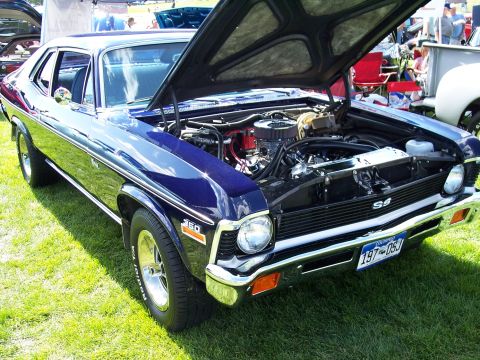 1972 Ford Ranchero - A blue muscle car, possibly a 1970 model, is displayed with its hood open, revealing the engine and SS badging.